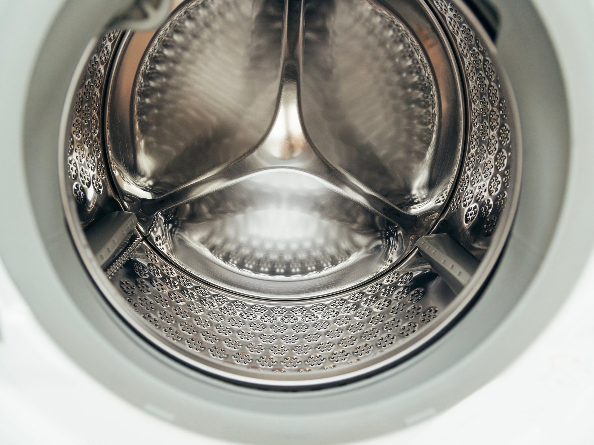 Stainless drum of a front-load washing machine, close-up
