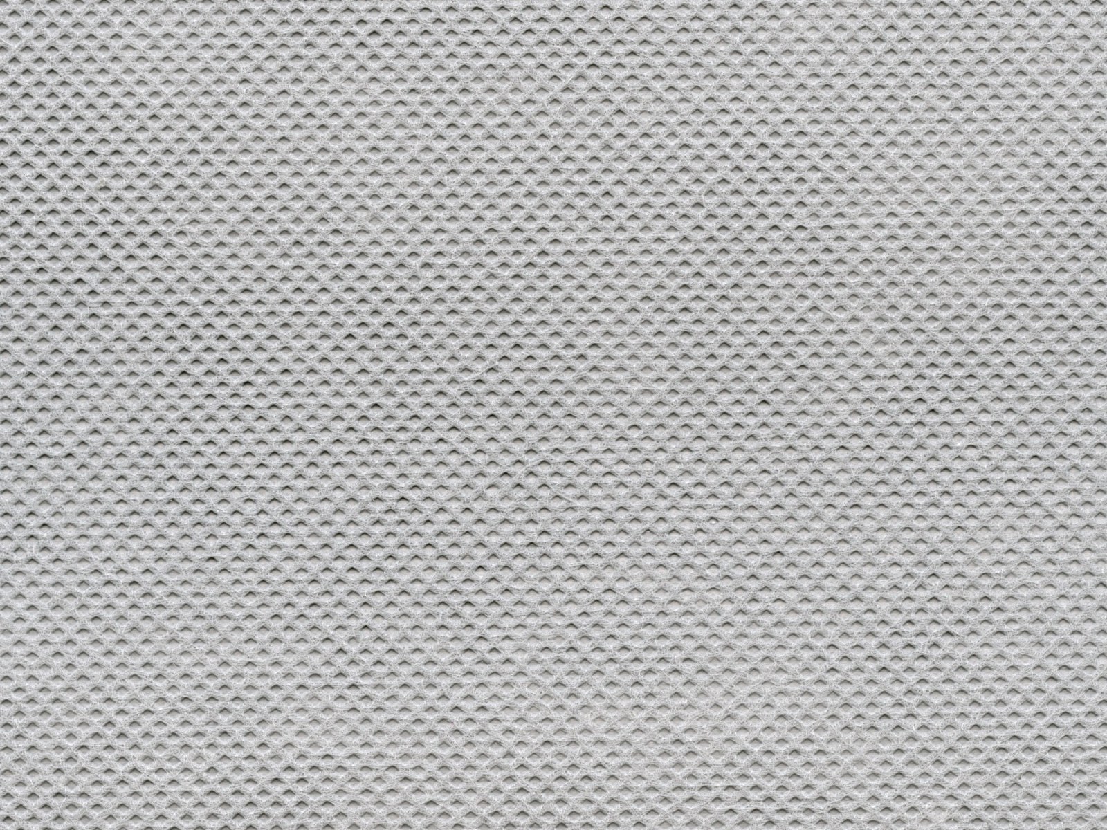 Soft white nonwoven web, bonding pattern and fiber structure in close-up