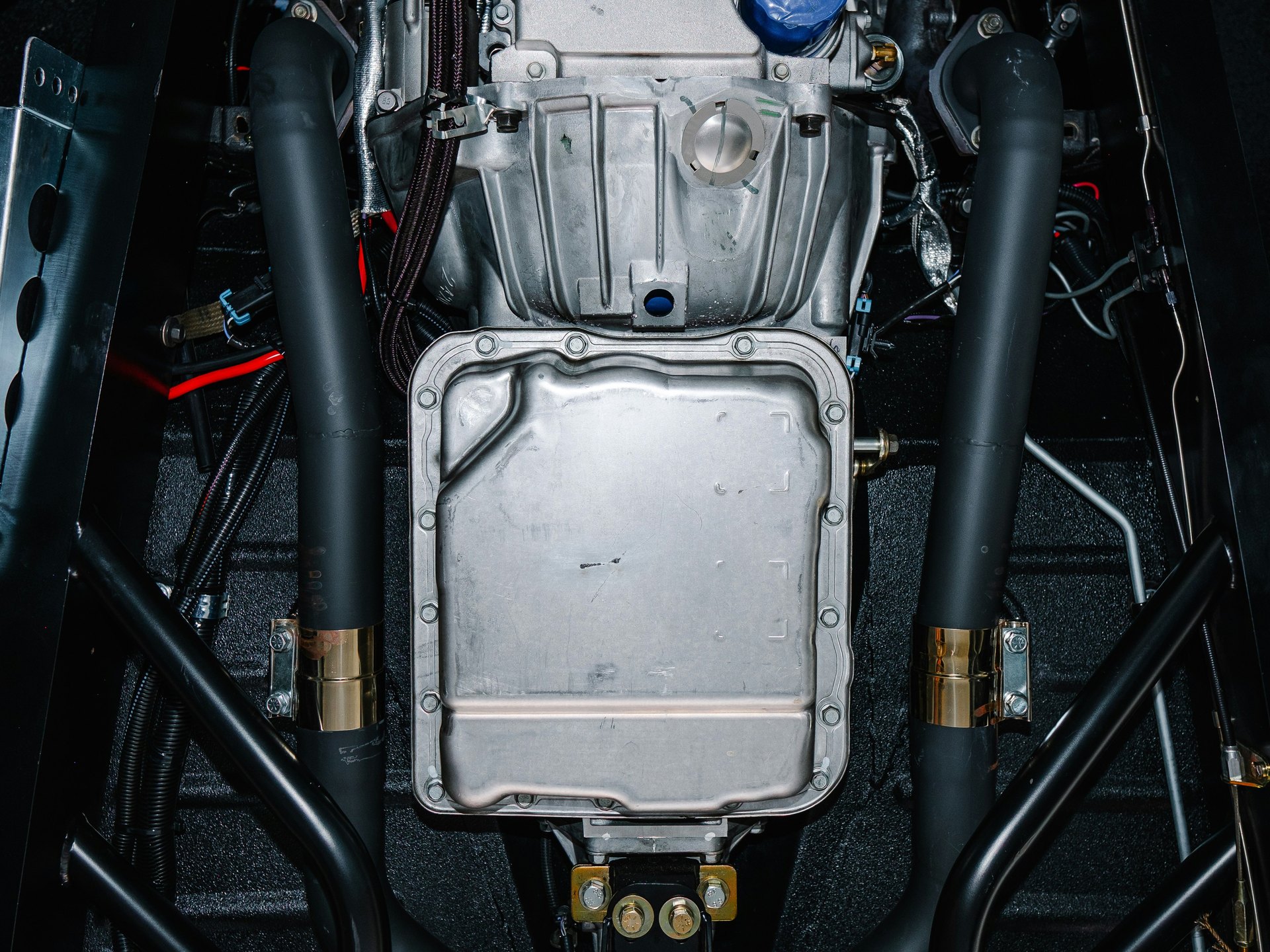Engine sump and powertrain underside seen from below — representative image